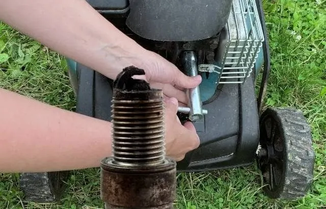 Identify a bad lawnmower spark plug