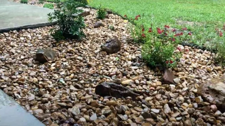 Using river rock for drainage.